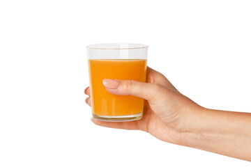 The hand holds a glass of orange juice. Isolated on white background.
