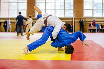 male athletes judoka in judo fight