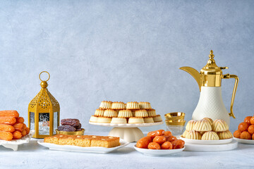 Assorted semolina maamoul or mamoul cookies , awameh or lokma with dallah and ramadan decor. Traditional arabic Eid al Adha, Eid al Fitr , Ramadan sweets - obrazy, fototapety, plakaty