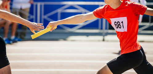 men relay race running track and field competition