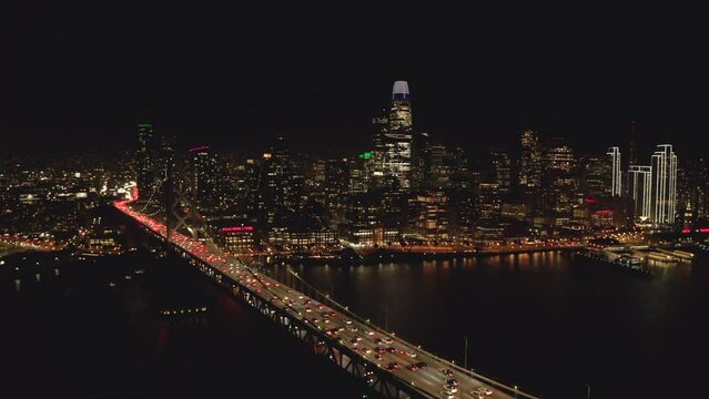 Stationary aerial shot of downtown San Francisco from the bay bridge at night