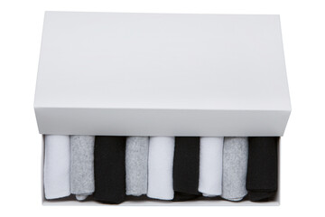 A set of nine gray, white and black socks in a white box, the box is partially open, isolate, flat...
