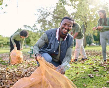 Trash, Volunteer Portrait And Man Cleaning Garbage Pollution, Waste Product Or African Environment Support. Plastic Bottle Container, NGO Charity And Nature Park Clean Up By Eco Friendly Community