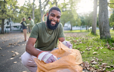 Black man, volunteer portrait and plastic bag for community park cleanup, recycling or cleaning....