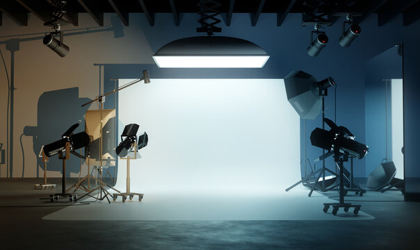 A large blank photo studio background with various lighting equipment. 3D illustration