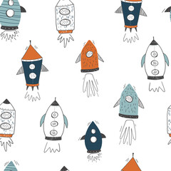 Seamless childish cosmic pattern with cute rockets. Repeating texture doodle style universe. Colored flat vector illustration of cosmos background.