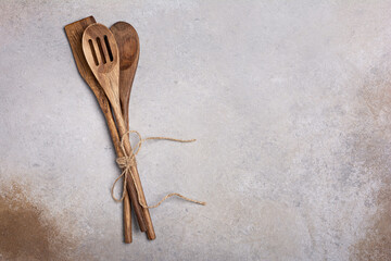 Rustic wooden kitchen cutlery as spoons and scapula for cooking