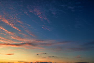 The sky before dawn, orange clouds on the background of the blue sky.
