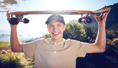 Sports, skateboard and portrait of man on mountain for adventure, freedom and ready for skateboarding. Fashion, fitness and face of skater smile with longboard for exercise, skating and training © J Bettencourt/peopleimages.com