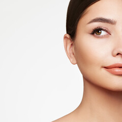 Fototapeta premium Portrait beautiful young woman with clean fresh skin. Model with healthy skin, close up portrait. Cosmetology, beauty and spa