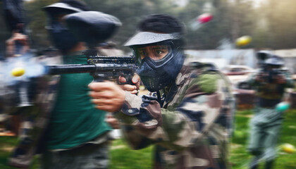 Paintball gun, shooting and men in camouflage with safety gear at military game for target practice. Teamwork, sports training and war games, play with rifle and friends working together at army park