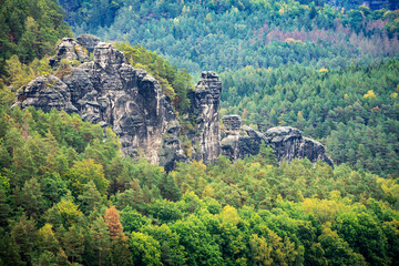 Panoramic birdview over monumental Bastei sandstone pillars near Kurort Rathen village in the national park Saxon Switzerland by Dresden and Elbe river, Saxony, Germany