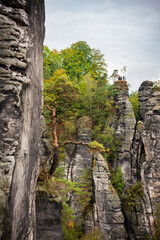 Panoramic birdview over monumental Bastei sandstone pillars near Kurort Rathen village in the national park Saxon Switzerland by Dresden and Elbe river, Saxony, Germany