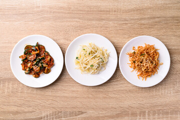 Korean side dish, Mung bean sprouts salad and kimchi cucumber, Table top view