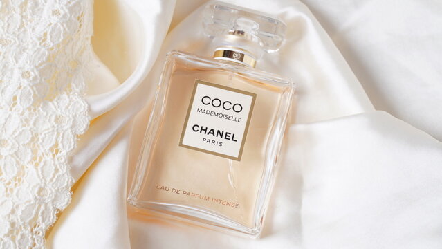Jeddah Saudi Arabia March 31 2021 COCO chanel Floral scent concept. Perfume  bottle with lflowers over pink pastel background Flat lay and copy space  top view. Stock Photo