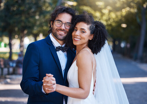 Couple portrait, wedding and happy dancing outdoor at marriage celebration event together with love. Interracial man and woman at park with trust, partnership and care for commitment to partner