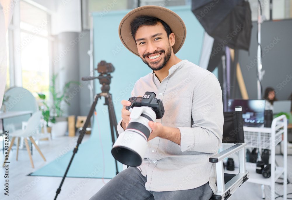 Poster Portrait, photographer and man with camera in studio, happy and smile before a photo shoot. Face, photography and asian guy relax during professional, shooting for model, design and creative career