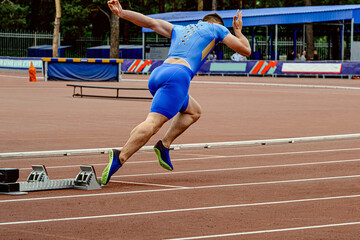 male runner start sprint race in athletics