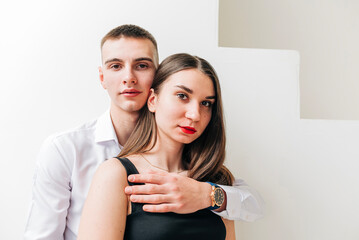 Young couple girl and boy in the studio modern lifestyle portrait. Love and relationship