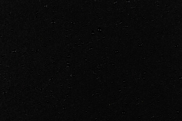 Water drops on dark stone