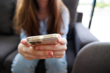 Smart phone. Young caucasian female student use martphone
