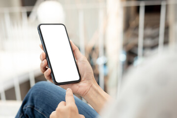 cell phone blank white screen mockup.hand holding texting using mobile on desk at office.background empty space for advertise.work people contact marketing business,technology