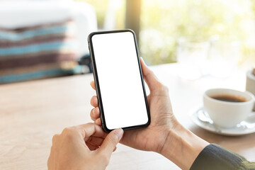 cell phone blank white screen mockup.hand holding texting using mobile on desk at office.background empty space for advertise.work people contact marketing business,technology