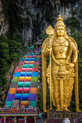 The golden Buddha and colorful stairs  in front of the Batu Caves, Kuala Lu,pur, Malaysia