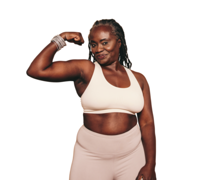 Mature black woman flexing her bicep while standing against a transparent background