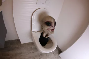 Foto auf Acrylglas Spooky alien inside toilet bowl  © ajr_images