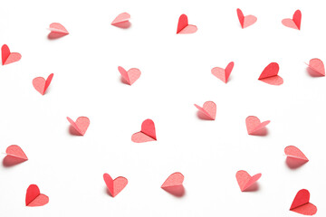 Hearts cut out from white paper. Festive background for valentine's day.