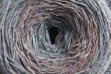 Round skein of wool yarn. Hobby, knitting, needlework.