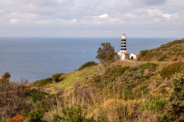 Fototapeta na wymiar Sarpincik lighthouse located at the westernmost tip of Turkey