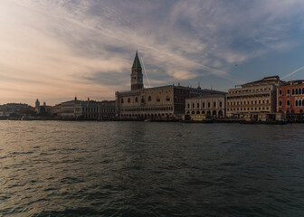 Fototapeta na wymiar Sunset in Venice, Italy over the Giudecca canal with view of the Doge's Palace