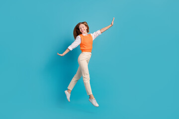 Fototapeta na wymiar Full length photo of positive carefree lady wear stylish outfit go buy trendy clothes empty space isolated on blue color background