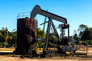 Oil rig pump machine drilling from oil field, Environment concept