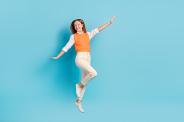 Obraz premium Full length photo of overjoyed lady wear stylish clothes rejoice summer holidays empty space isolated on blue color background