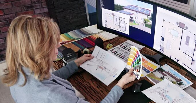Real Estate Designer Working On Computer