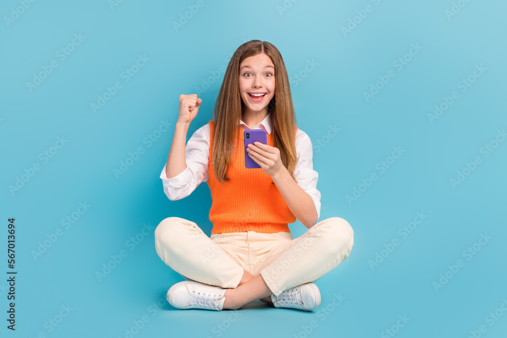 Poster full length photo of crazy excited lady sitting floor rejoice sale discounts modern gadgets devices 