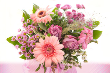 Colorful bouquet of pink flowers isolated on blur background.