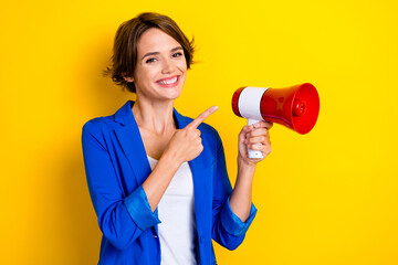 Photo of positive lady business agent speak discount offer point megaphone isolated on bright color...