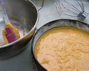 Close-up of a bowl with the raw dough for a carrot cake