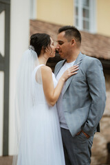 young couple the groom in and the bride on a walk