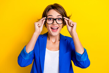Photo of young overjoyed funny surprised businesswoman try new eyeglasses after vision...