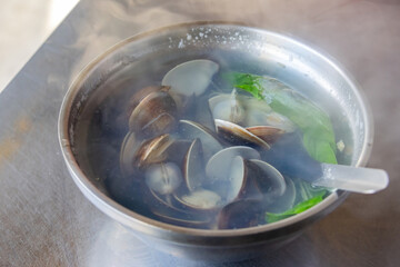 Close up shot of a hot clam soup