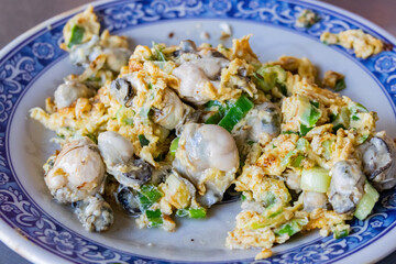Close up shot of savory fried oyster egg dish