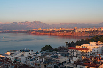 A red sunrise on the cliffs at Antalya Bay Turkey in January