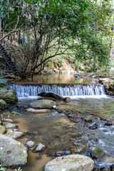 At a waterfall in Thailand