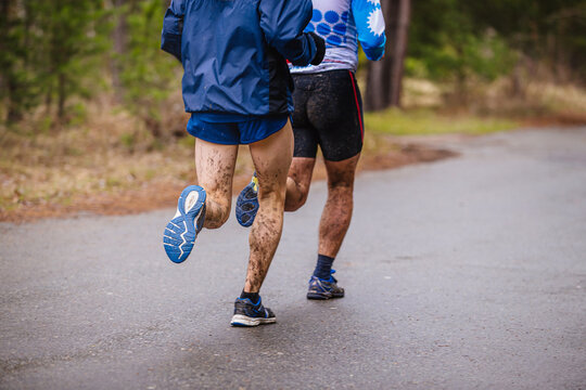 runners feet in mud splashes run spring race