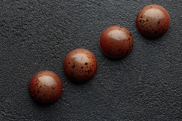 Painted handcrafted chocolate bonbons. Delicious dessert